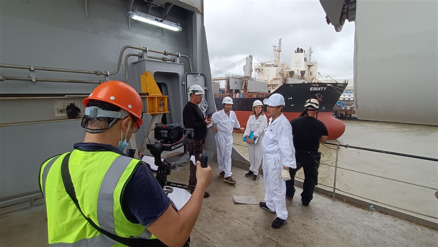 Ningbo production team discussing a brief near a location setup